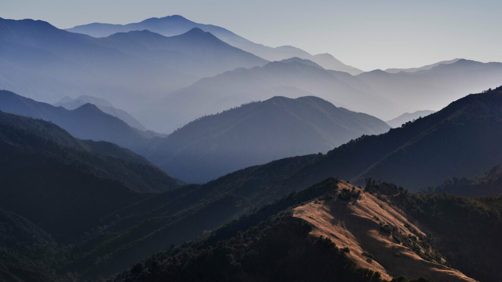 Enchanting Mountain Vistas: The Majestic Backdrop of macOS Big Sur Unveiled at Apple's October 2020 Event - A Captivating HD Wallpaper