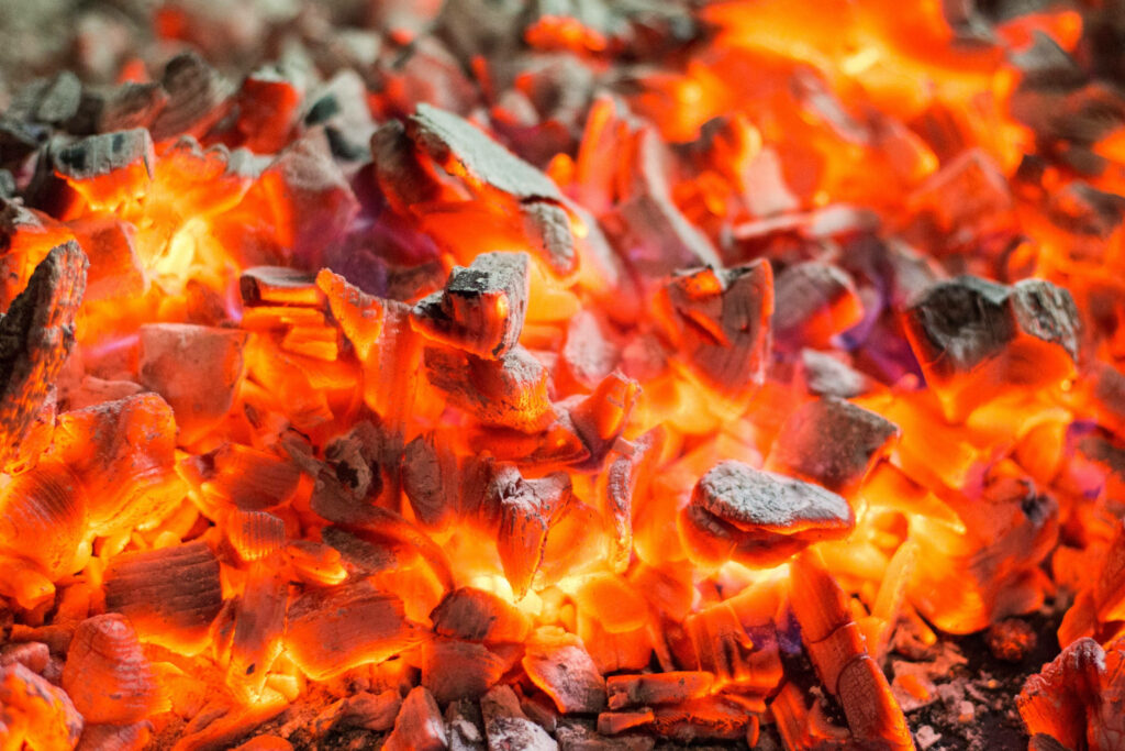 Burning Brilliance: Mesmerizing 4k Fire Background Illuminates with a Small Pile of Embers Wallpaper
