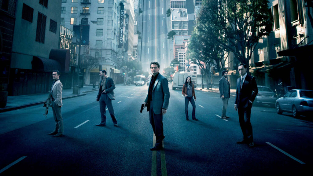 Inception main cast on surreal city street wallpaper capturing dreamlike intense atmosphere