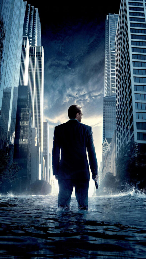 Inception concept art wallpaper man in suit standing water between towering city skyscrapers