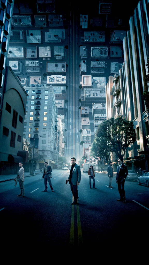 Inception wallpaper with main characters on a city street and buildings folding upward in dream world
