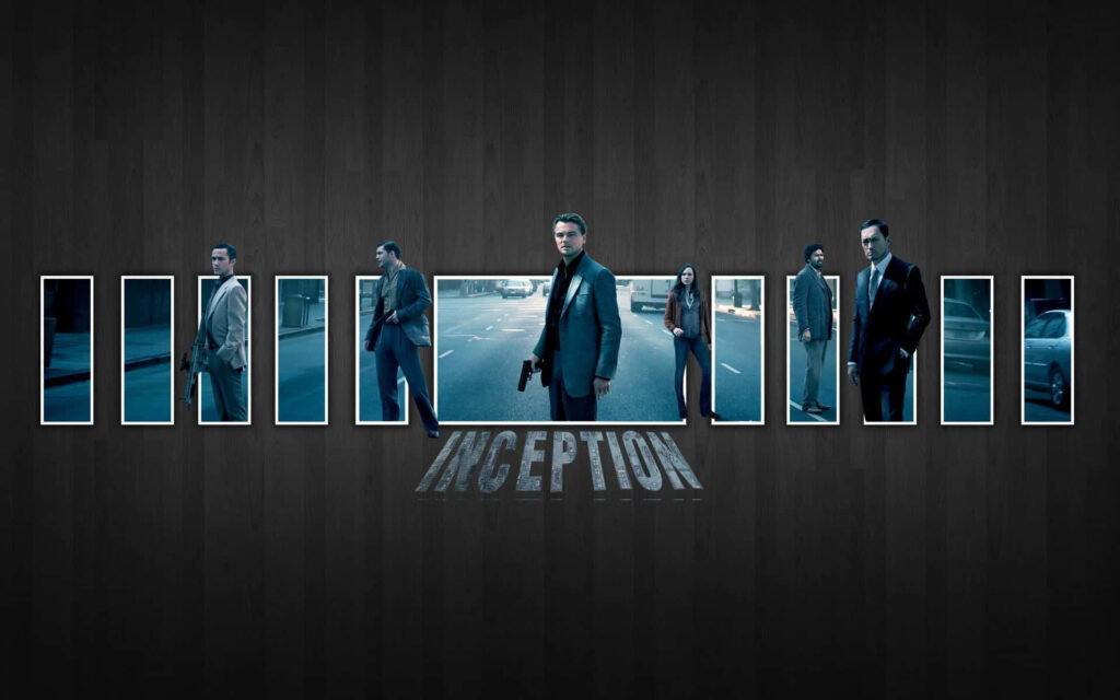 Inception main characters standing on city street panoramic wallpaper with movie title below