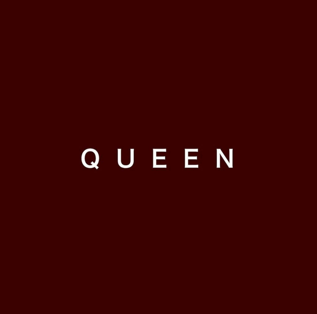 Regal Queen: A Stunning Poster Artwork in Maroon Color Wallpaper
