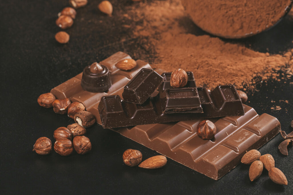 Indulgent Chocolate Bars with Nuts - Warm Brown Wallpaper Background