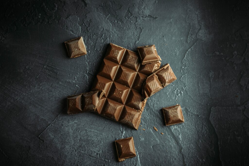 Indulgent Chocolate Wallpaper on Textured Dark Background