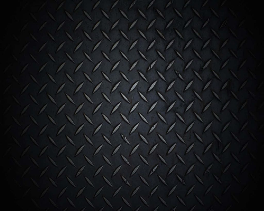 Dark industrial steel wallpaper with realistic diamond plate texture and metallic highlights