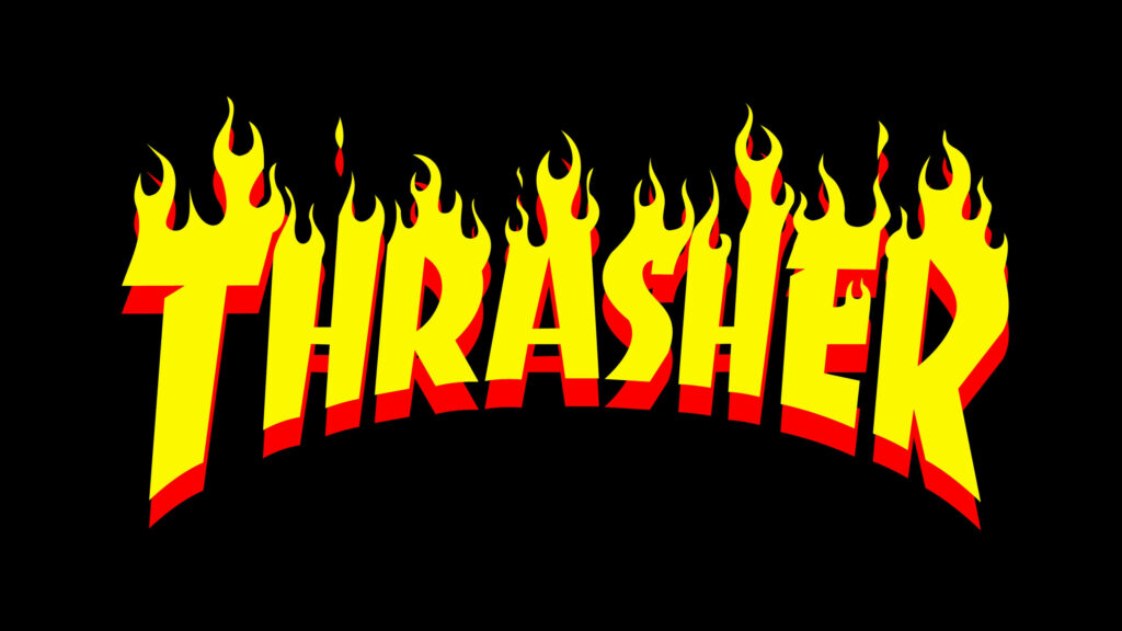 Fiery Brilliance: Thrasher's Bold Logo Ignites the Black Abyss Wallpaper