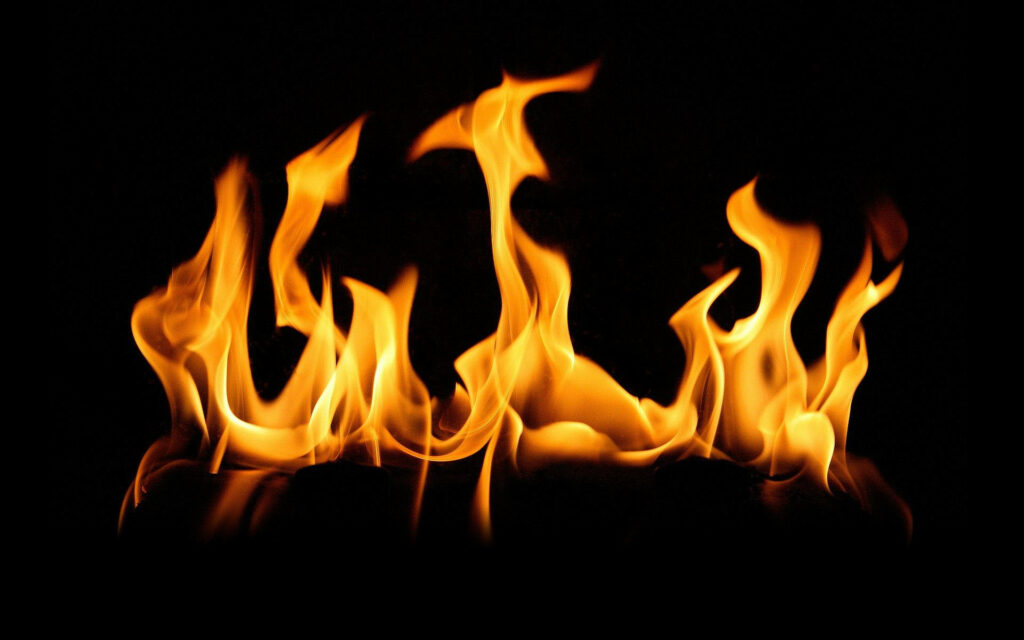 Fiery Inferno: A Scorching Blaze Engulfs the Air with Oppressive Heat Wallpaper