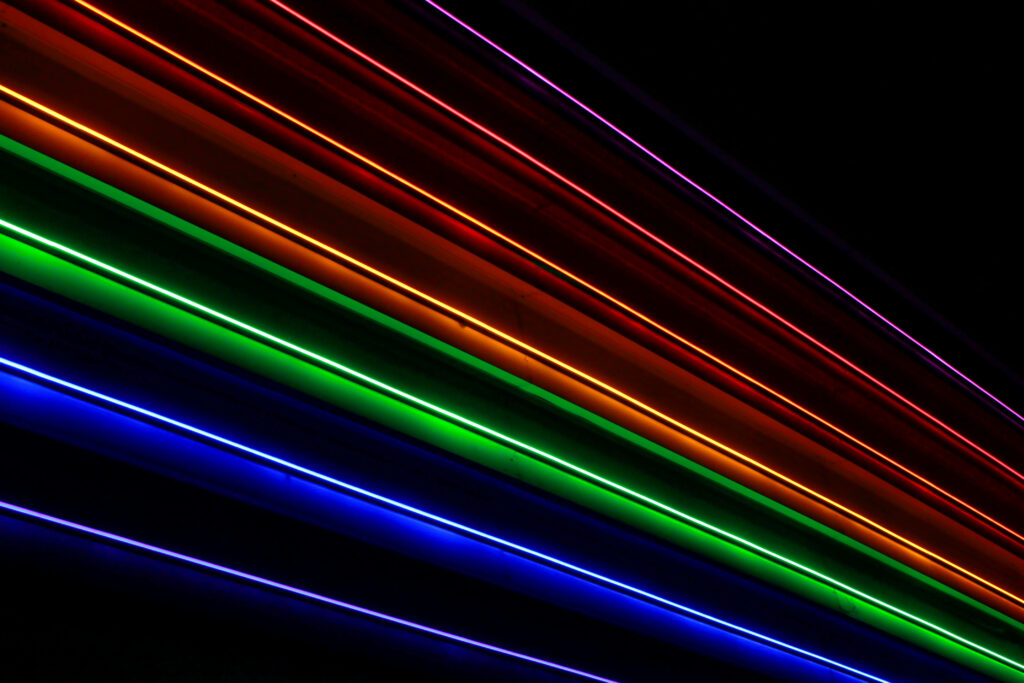 Vibrant Stripes: Illuminating the Dark with Rainbow Neon Lights for a Digital Art of Inclusive Essence Wallpaper