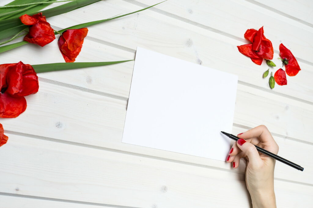 Creative Potential: A Woman Embracing Inspiration by a Blank Canvas Wallpaper