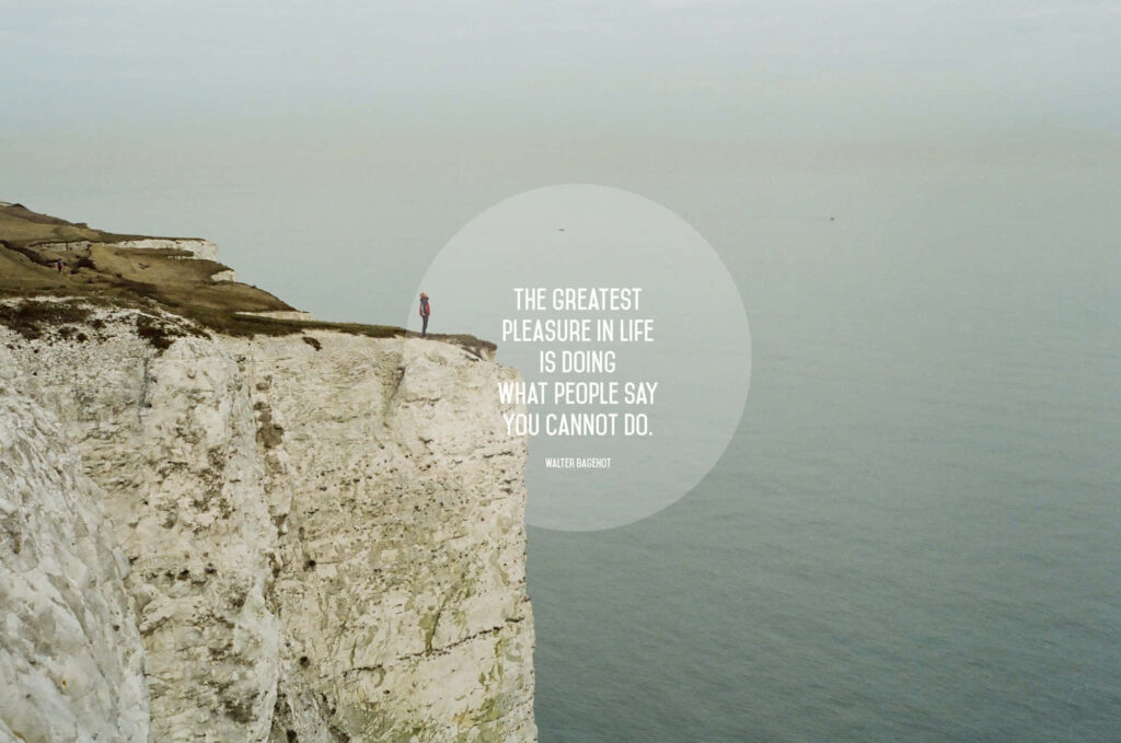 Motivational Seascape Wallpaper: Courage at the Cliff's Edge