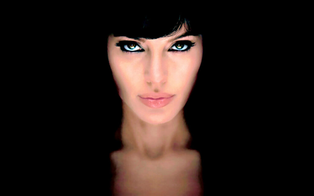 Angelina Jolie Wallpaper: Intense Gaze & Sharp Features Background