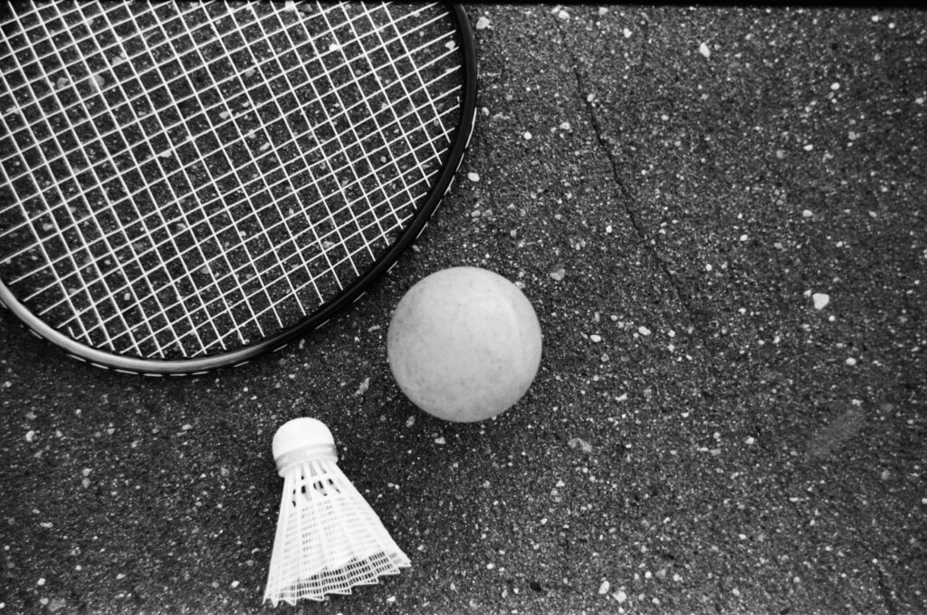 Badminton and Shuttlecock on Surface Background Wallpaper