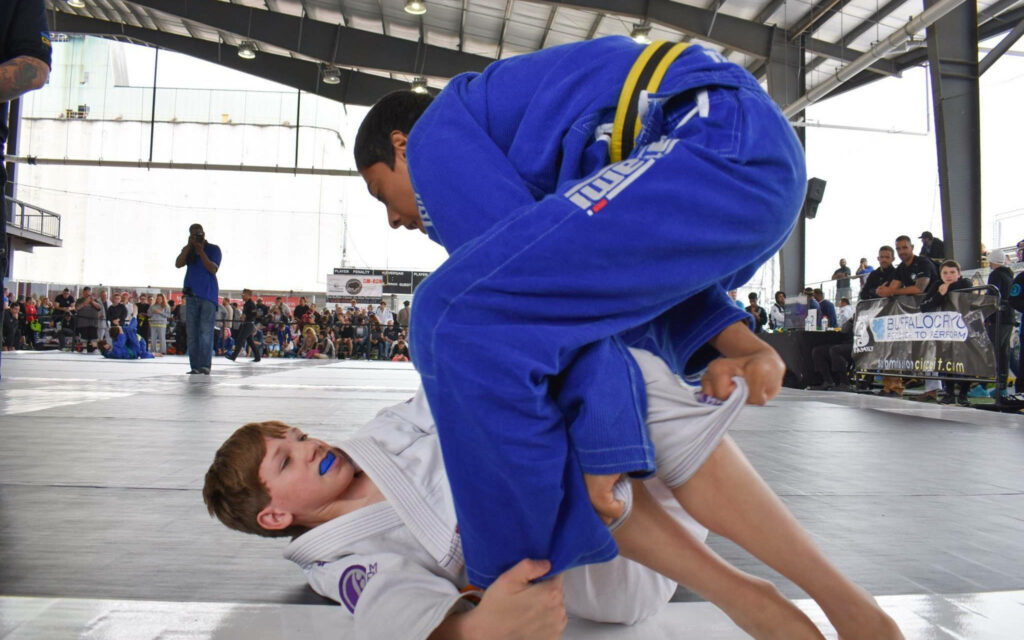 Dynamic Brazilian Jiu-Jitsu Wallpaper: Half Guard Action on the Mat