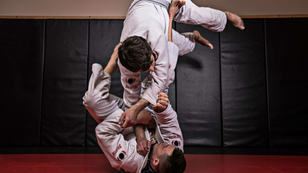 Intense Brazilian Jiu-Jitsu Sparring Wallpaper - Gi Practitioners