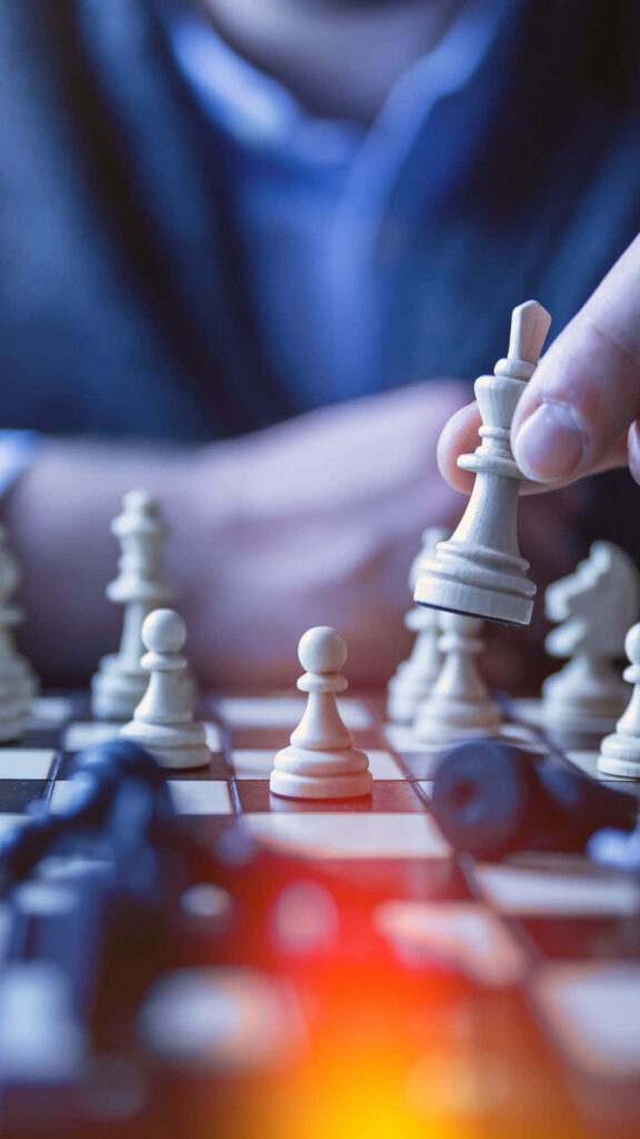 Intense Chess Game Wallpaper: Focused Player & Detailed Setup