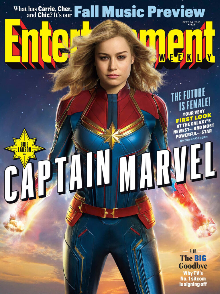 Intense Gaze: Carol Danvers Channels Captain Marvel's Vibrant Super Suit Wallpaper