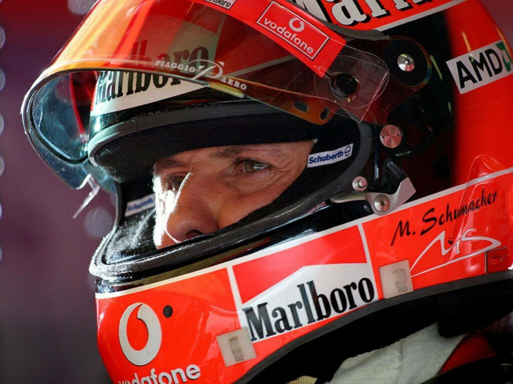 Intense Michael Schumacher Close-Up: Racing Helmet Wallpaper