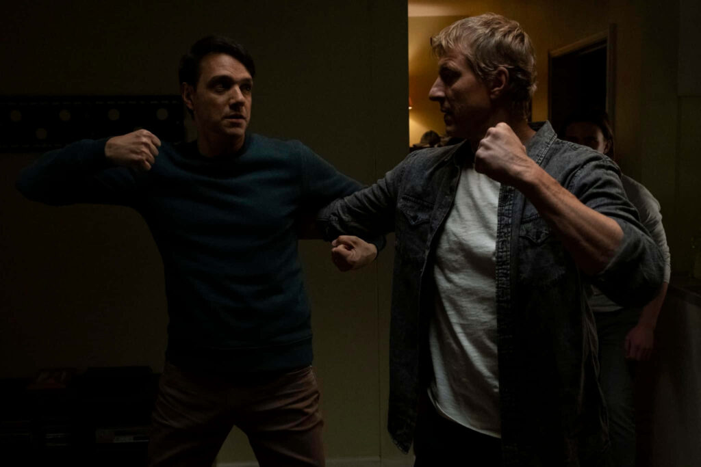 Dynamic Cobra Kai Wallpaper: Intense Action Showdown Background