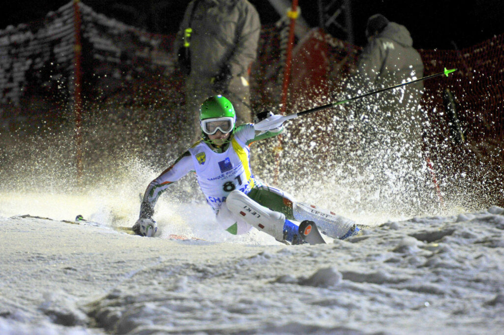 Precision Skiing Action: Intense Downhill Race Wallpaper Background