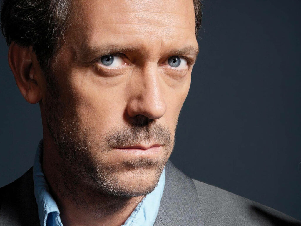 Intense Dr. Gregory House Wallpaper: Dark Background Elegance