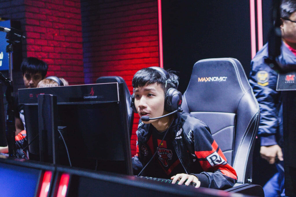 Esports gamer focused at glowing setup in high tech arena during intense online tournament teamwork Wallpaper