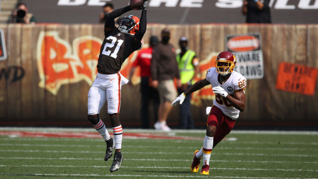 Intense Football Wallpaper: Denzel Ward's Epic Interception Action