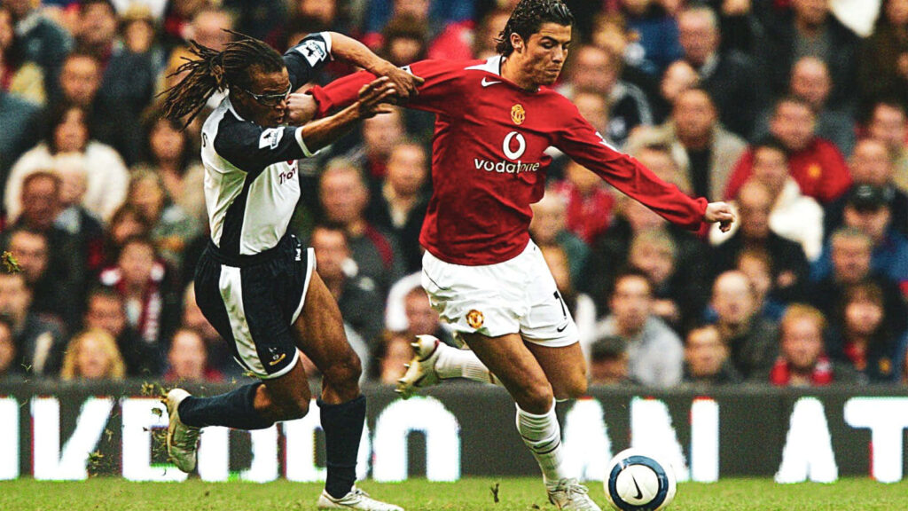 Intense Football Wallpaper: Davids vs. Ronaldo Match Moment