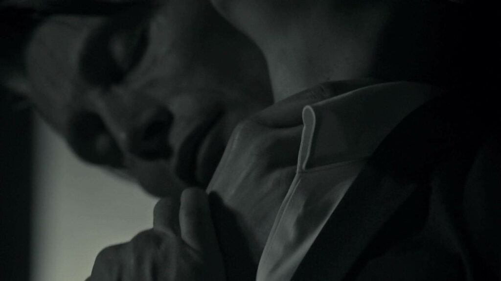 Intense Hannibal Series Wallpaper: Dark Emotional Close-Up Scene