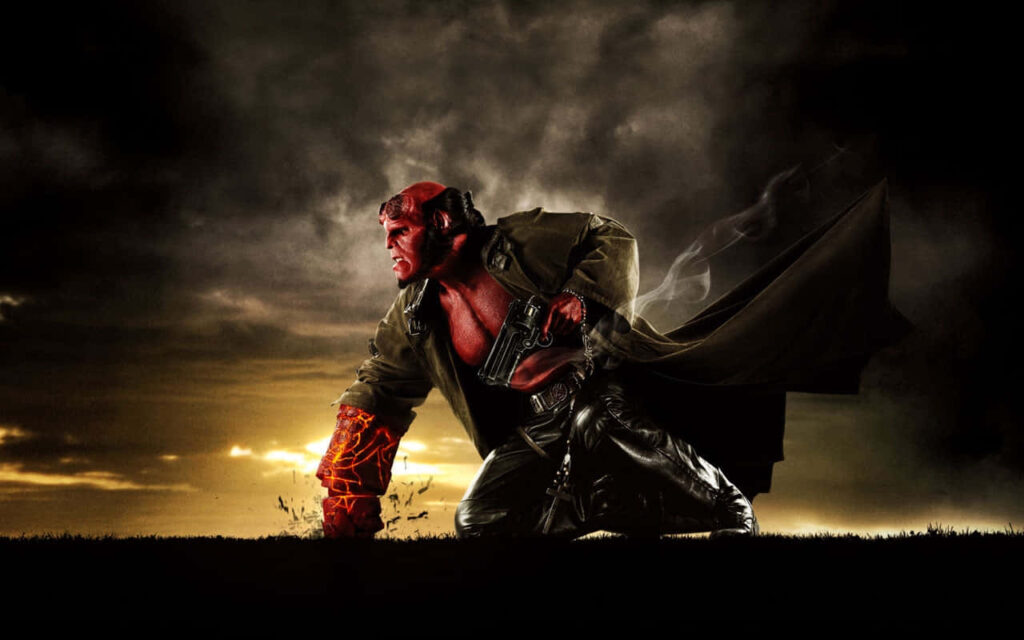 Intense Hellboy Kneeling with Fiery Arm - Dramatic Sunset Wallpaper