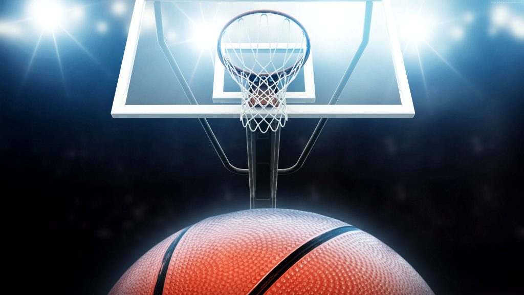 High-definition basketball wallpaper textured ball under glass hoop in dark arena with spotlights