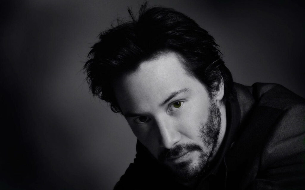 Intense Keanu Reeves Close-Up Wallpaper in Dark Dramatic Colors
