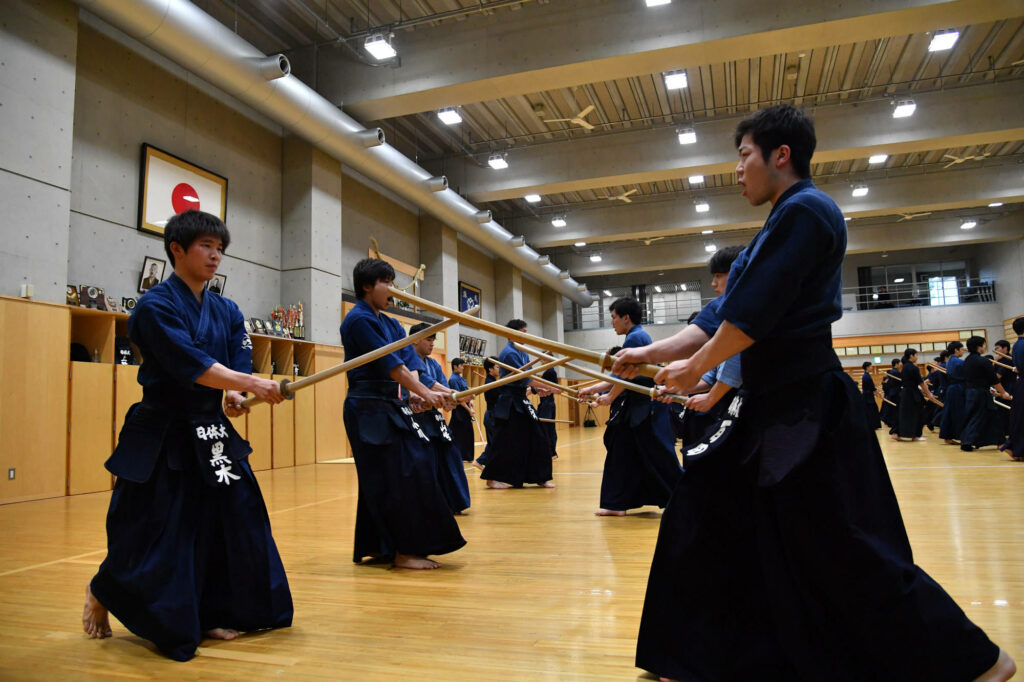 Intense Kendo Practice Wallpaper - Japan Sports Education University