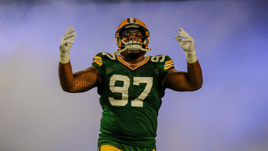 Intense Kenny Clark Wallpaper: Dominant NFL Defensive Tackle