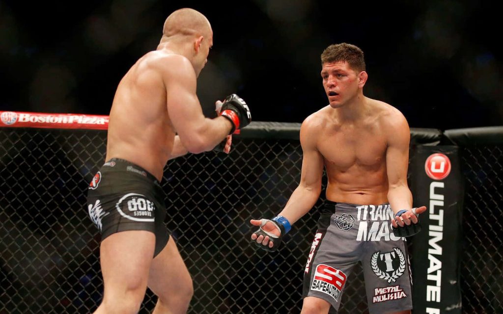 MMA stars Nick Diaz and Georges St-Pierre face off in UFC octagon intense action sports wallpaper