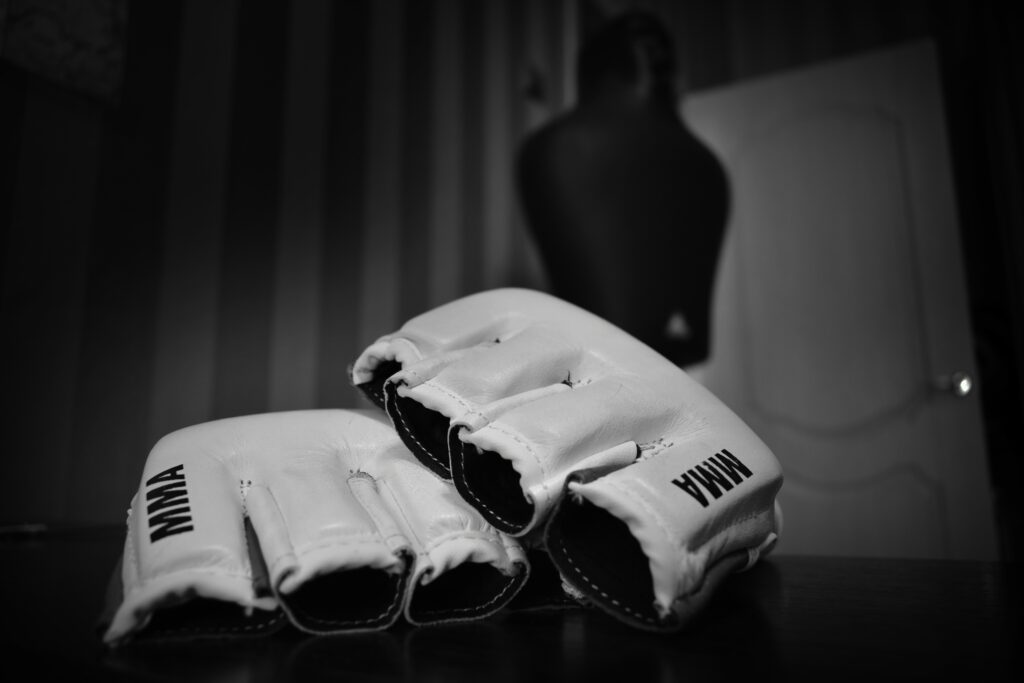 Intense MMA Gloves Close-Up: Black-and-White Wallpaper Art