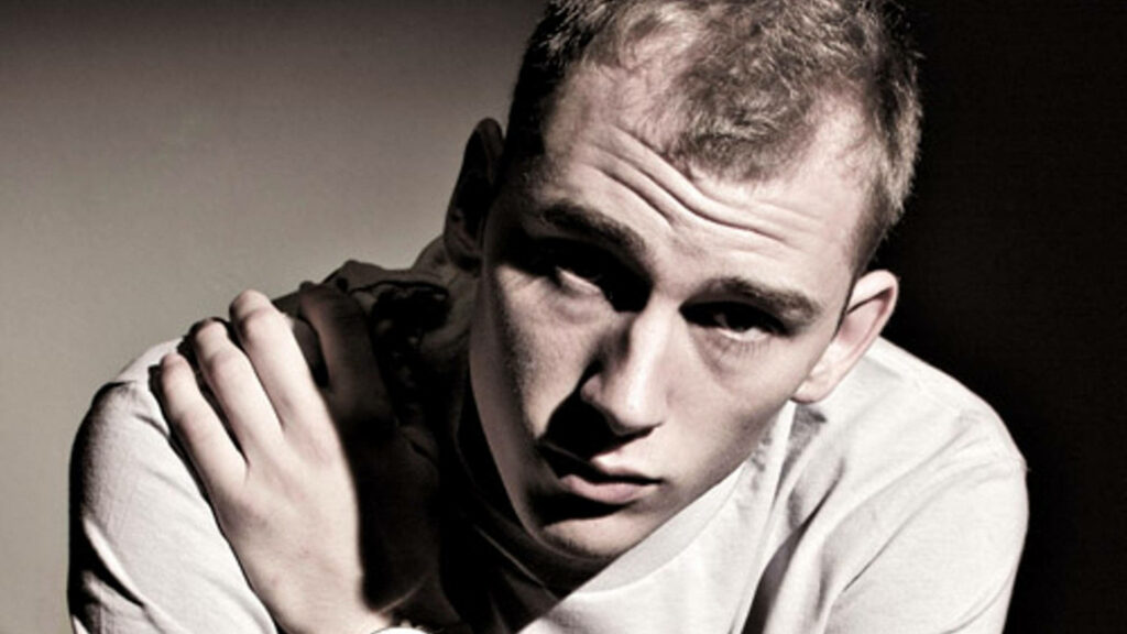 Close-Up Wallpaper of Machine Gun Kelly: Intense Expression & Detail
