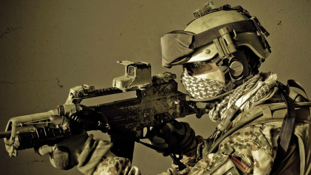 German Bundeswehr soldier in Flecktarn camo aiming HK G36 rifle intense combat wallpaper