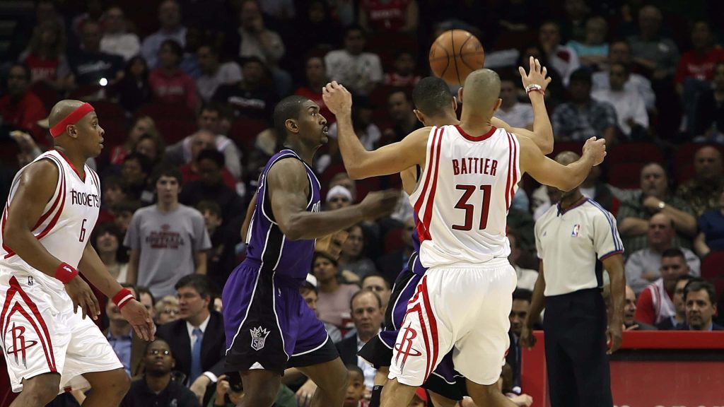 Houston Rockets Shane Battier and Bonzi Wells defend intensely against Sacramento Kings player NBA game action wallpaper