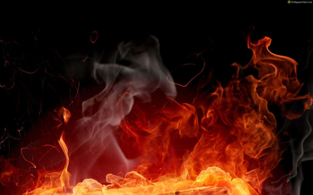 Fiery Orange and Red Flames Wallpaper on Black Background