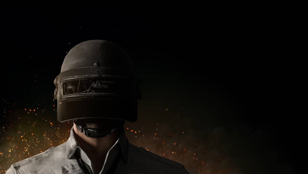 Soldier wearing Level 3 Spetsnaz helmet in PUBG digital wallpaper with glowing embers background