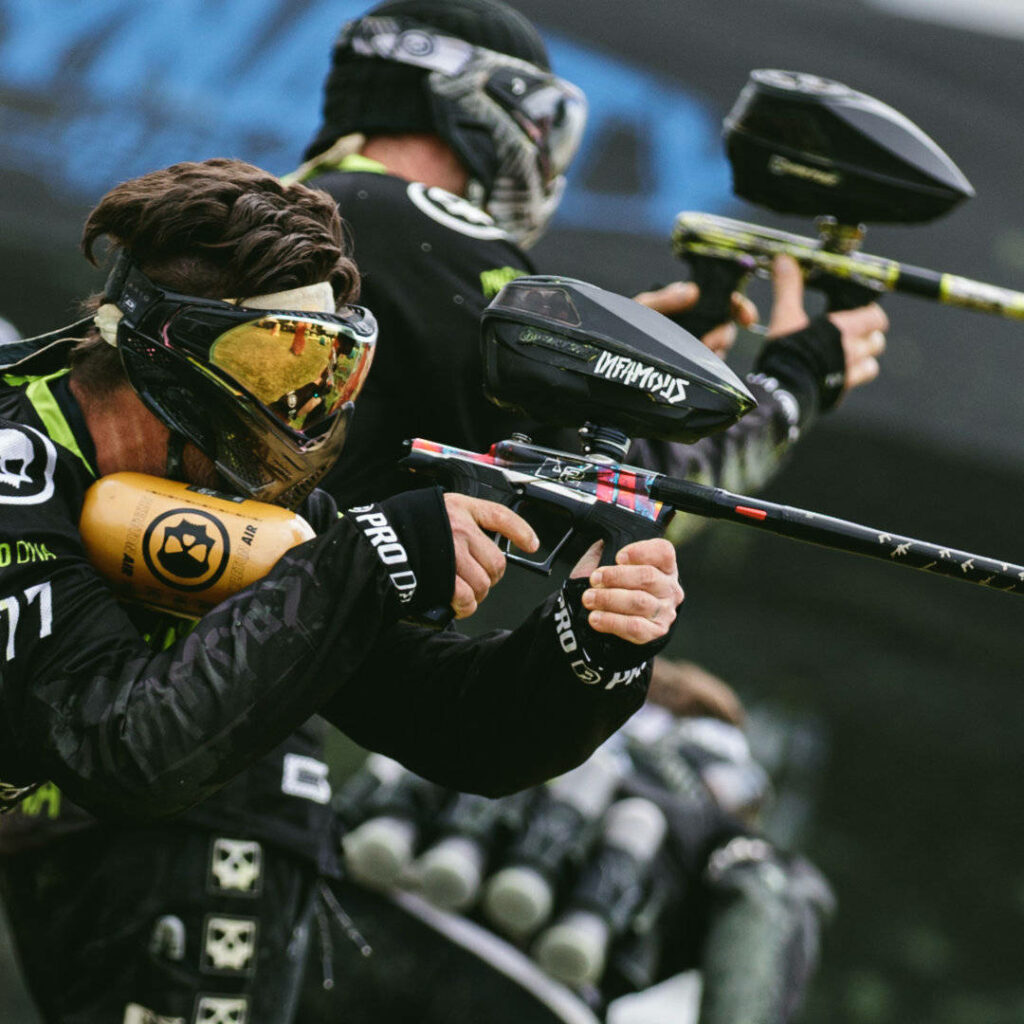 Intense Paintball Action: Tactical Players in Competitive Match Wallpaper