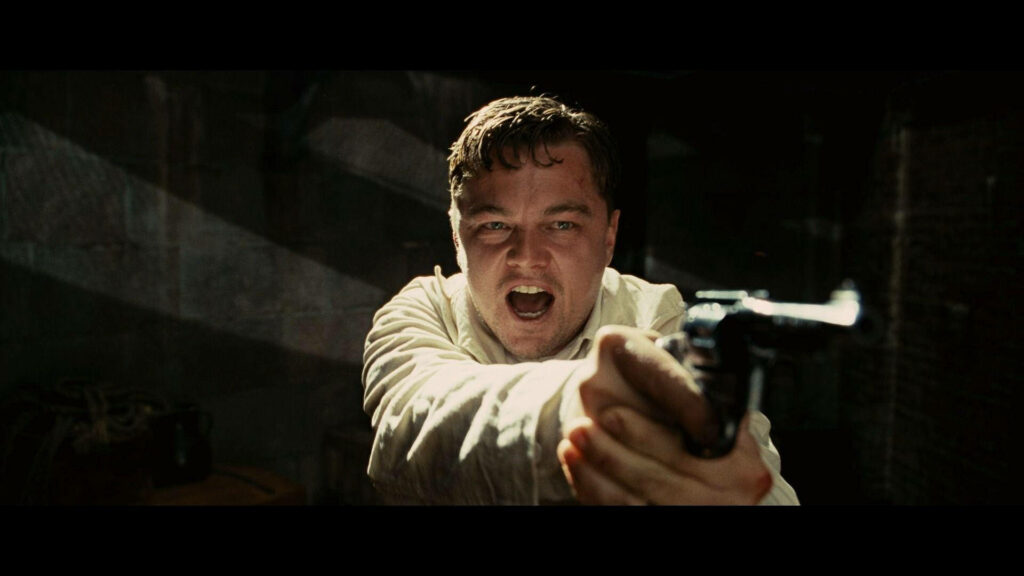 Dramatic Shutter Island Wallpaper: Leonardo DiCaprio with Gun