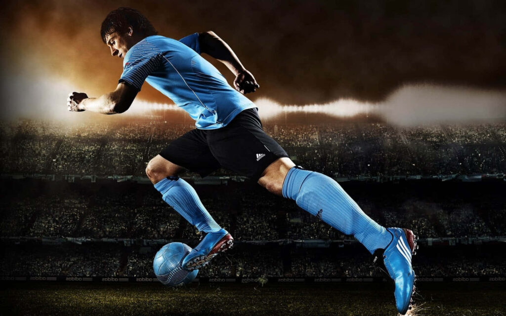 Intense Soccer Action Wallpaper: Player vs. Electrifying Stadium