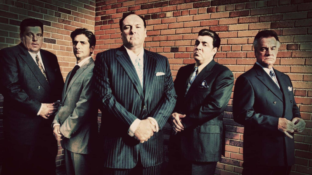 Intense Sopranos Characters Wallpaper: Bold Brick Wall Background