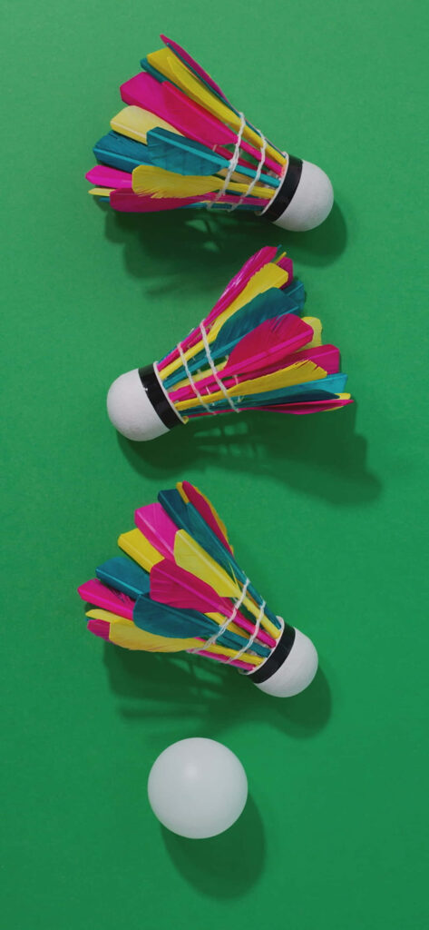 Badminton Shuttlecock on Green Minimal Background Wallpaper