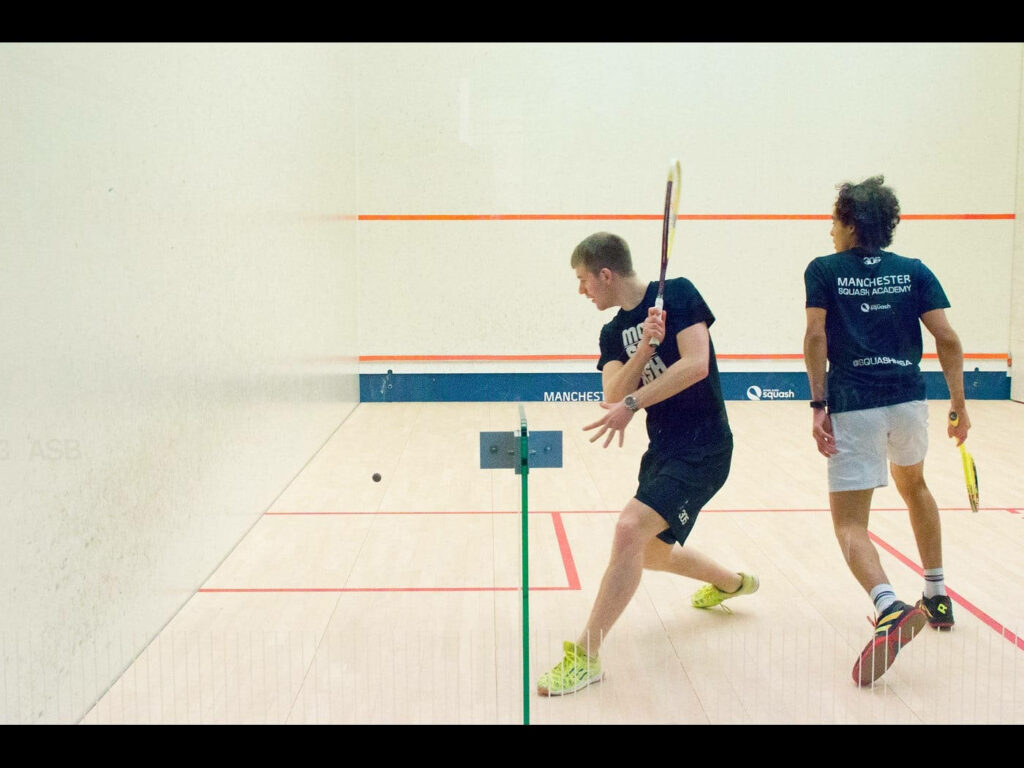 Intense Squash Match Wallpaper - Manchester Squash Academy Action
