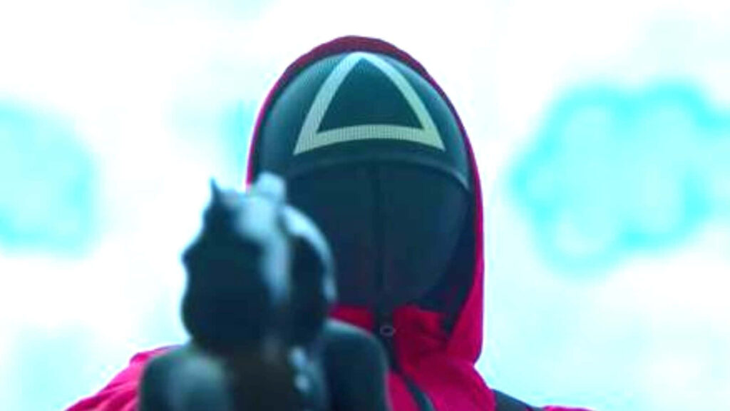 The Menacing Gaze of a Squid Game Enforcer: A Gripping Background Picture Wallpaper