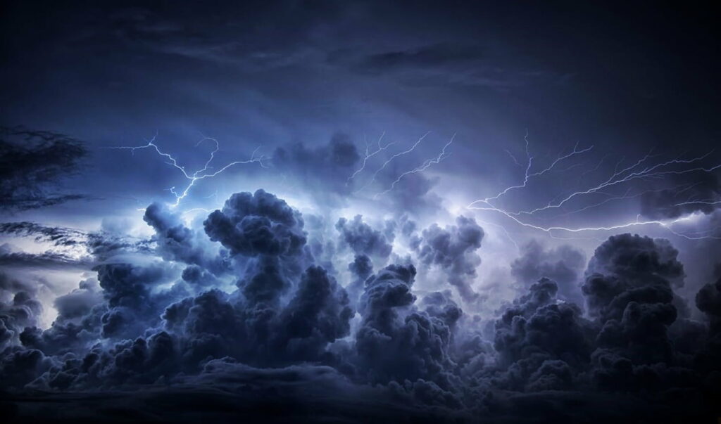 Intense Storm HD Wallpaper: Dark Clouds & Striking Lightning Background