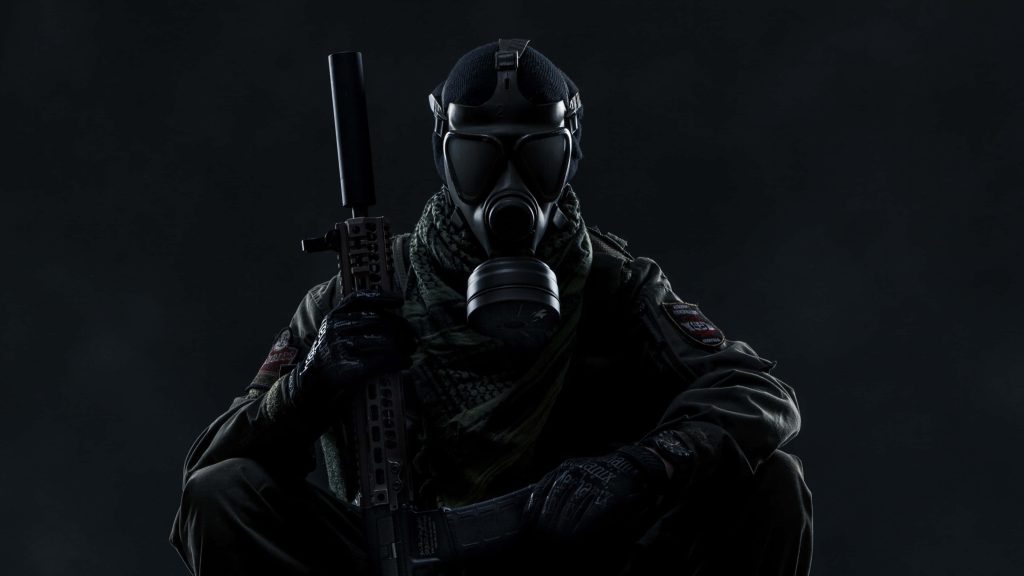 Tactical soldier in gas mask with shemagh and suppressed rifle dramatic military portrait wallpaper